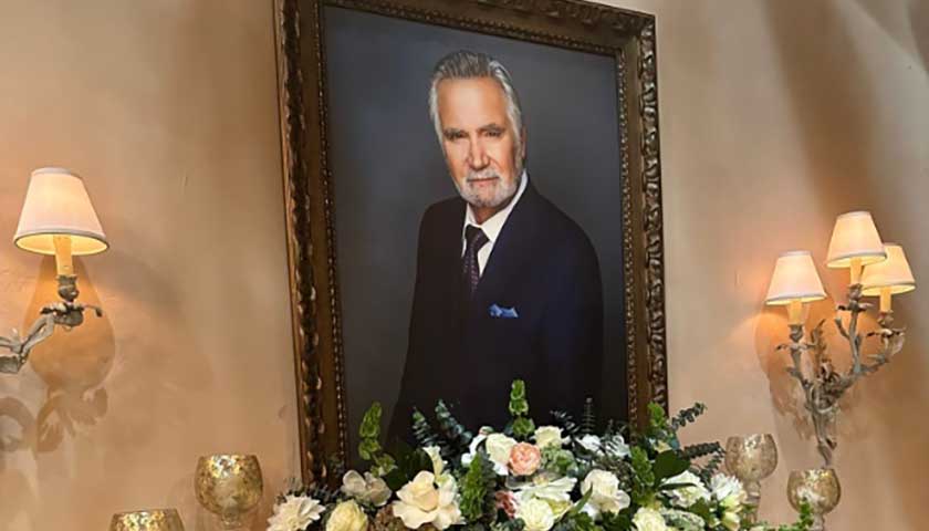 B&B Scoop; Eric's portrait with flowers beneath