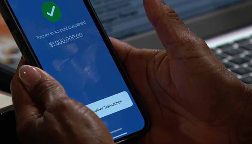 B&B Scoop: Grace's hands hold her phone, which shows a million dollar payment