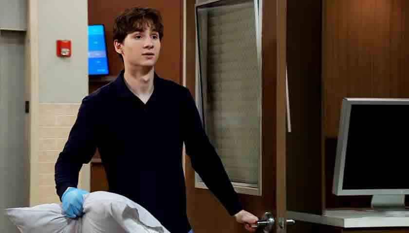 GH Scoop: Rocco holds a pillow with gloved hand, in doorway of Cullum's room