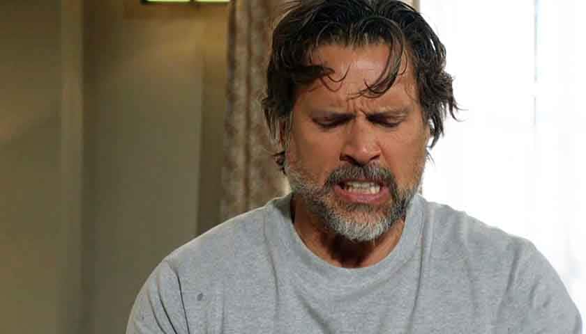 Y&R Scoop: Nick grimaces, as he looks down at his shaking hands