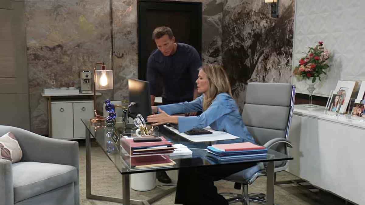 Carly and Jason looking at a laptop on General Hospital