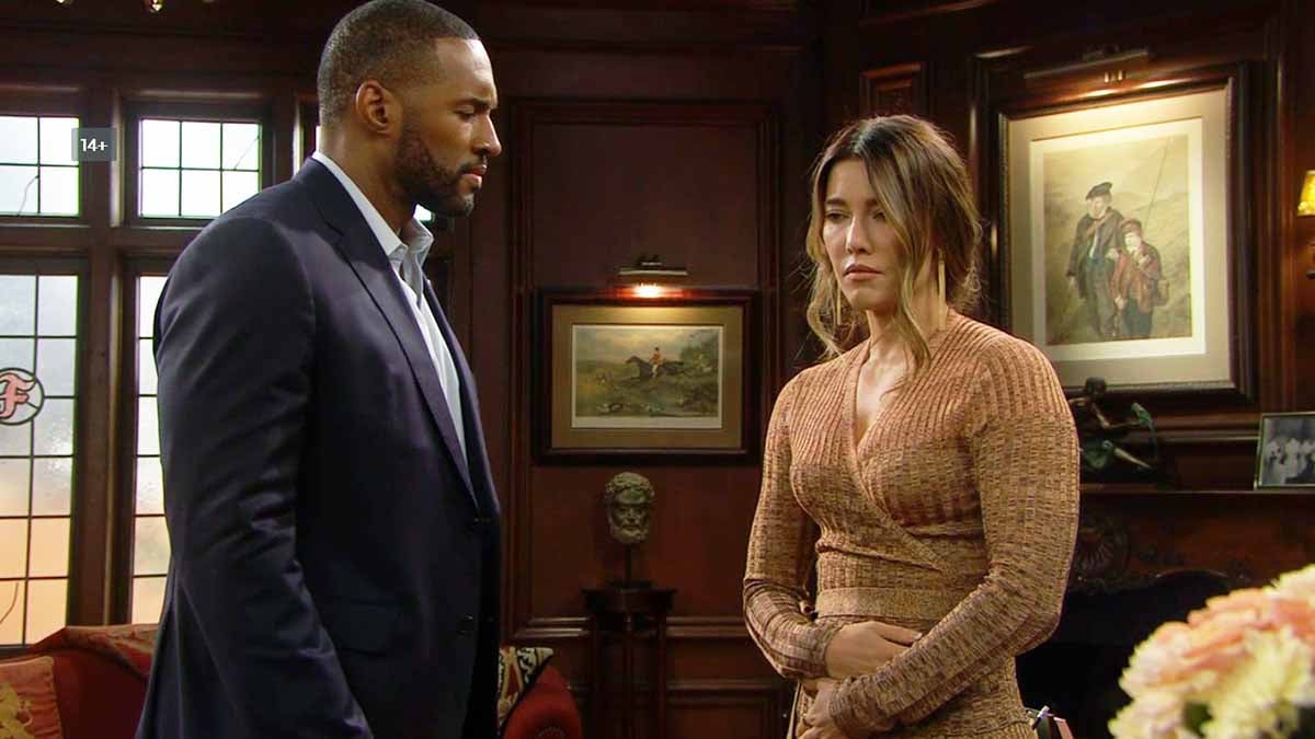 Steffy holds her tummy as Carter stares on Bold and the Beautiful