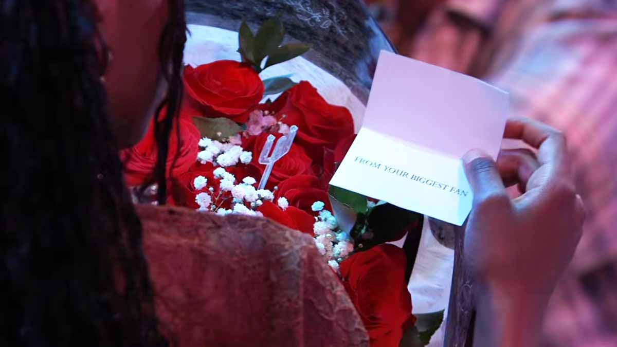 Trina holds a bouquet and a disturbing note on General Hospital