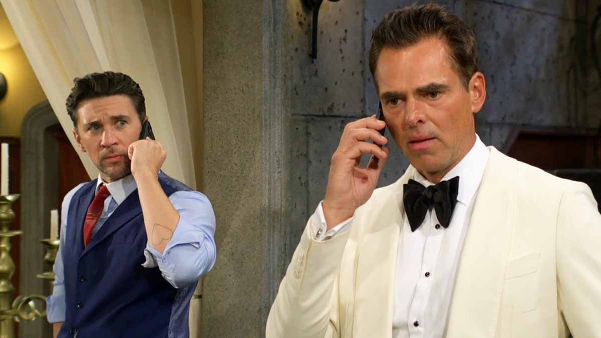 Billy and Cane on their phones in the GCAC lobby on Young and the Restless